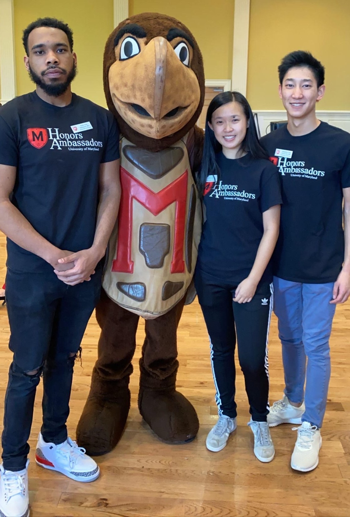 students pose in front of med school building